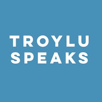 troylu speaks on a blue background